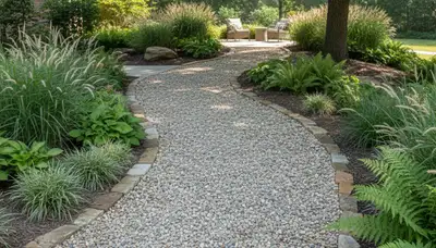 Pea gravel garden path with lush plantings installed by Memphis, TN landscaping professionals