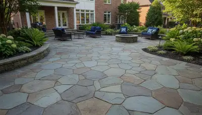 Flagstone patio with natural slate pavers expertly installed by landscaping pros in Memphis, TN